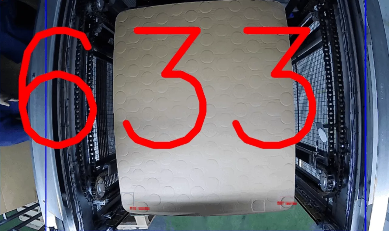 Neural network incorrectly identifying marks on corrugated cardboard as product lids.