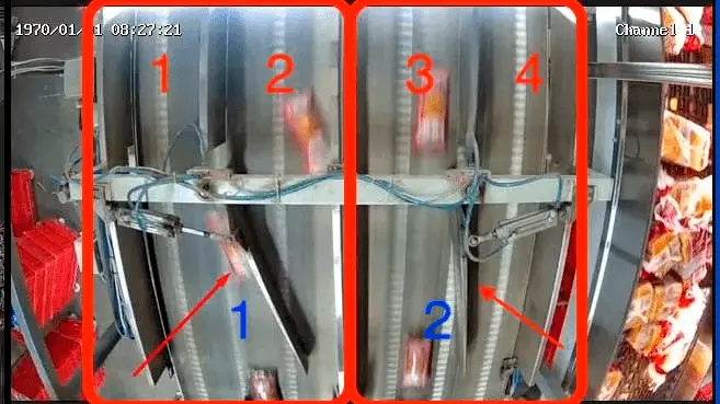 Conveyor paddle distributes bread flow automatically — 2 input streams to 4 output lines controlled by live count